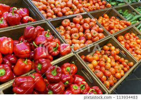 Vegetables harvest in boxes. Agricultural farm vegetables at the market or supermarket. Vegetables harvest in boxes. Agricultural farm vegetables at the market or supermarket. 113934483