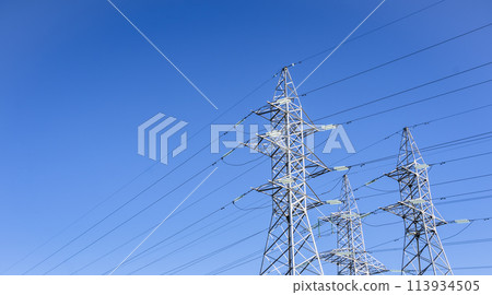 High voltage tower against the sky. Power transmission tower with wires 113934505