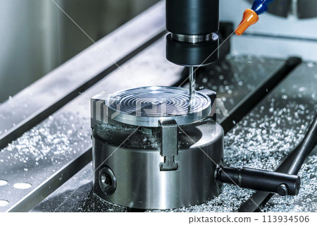 Lathe milling metal in industry. Process of machining a metal part Lathe milling metal in industry. Process of machining a metal part 113934506