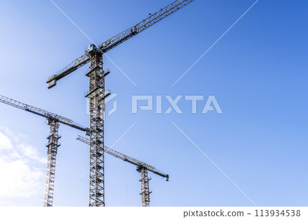 Construction industry building. Construction industry site with cranes, fittings and concrete. Construction industry building. Construction industry site with cranes, fittings and concrete. 113934538