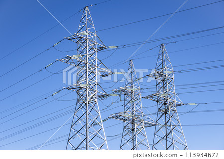 High voltage tower against the sky. Power transmission tower with wires 113934672