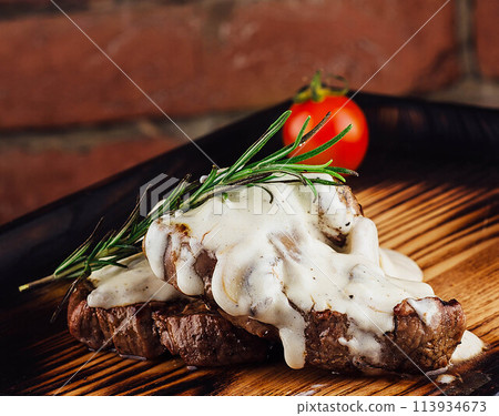 Juicy Beef Rib Eye Steak with mushroom sauce Juicy Beef Rib Eye Steak with mushroom sauce 113934673