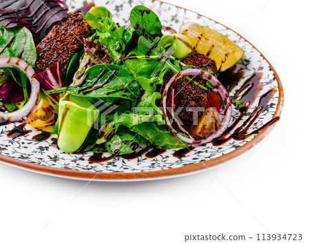 healthy green salad on plate isolated 113934723