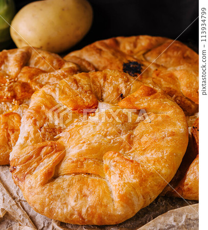 Cooking traditional pies with potatoes close up Cooking traditional pies with potatoes close up 113934799