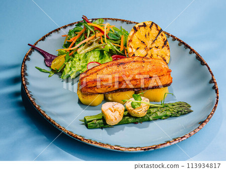 roast salmon steaks and shrimps with boiled asparagus roast salmon steaks and shrimps with boiled asparagus 113934817