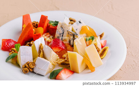 Cheese board with different types of cheese Cheese board with different types of cheese 113934997