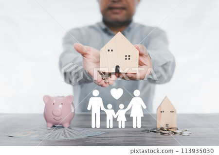 businessman holding simulated wooden house and a key. icon family on table, donation, saving, charity, family finance plan concept, fundraising, superannuation, investment, financial crisis concept. businessman holding simulated wooden house and a key. icon family on table, donation, saving, charity, family finance plan concept, fundraising, superannuation, investment, financial crisis concept. 113935030