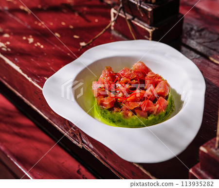 Salmon Tartare on Avocado Pillow 113935282