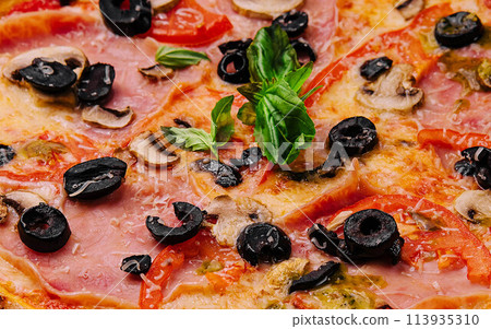 Appetizing sicilian pizza with ham and black olives 113935310
