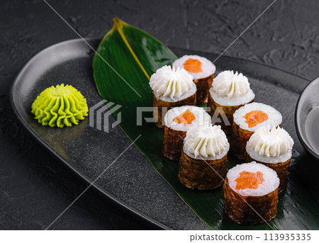 Sushi with Philadelphia Cheese and salmon on Black Asian Plate Sushi with Philadelphia Cheese and salmon on Black Asian Plate 113935335