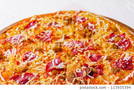 Pepperoni pizza with sausage close up Pepperoni pizza with sausage close up 113935394