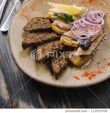 Herring with potatoes, onion with bread Herring with potatoes, onion with bread 113935456