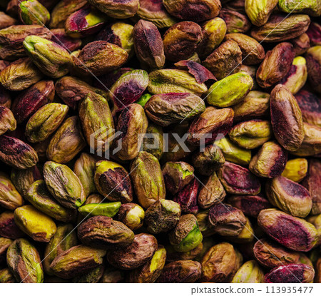 Pistachio nuts background close up Pistachio nuts background close up 113935477