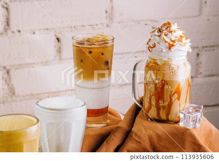 milkshake glasses featuring different flavors 113935606