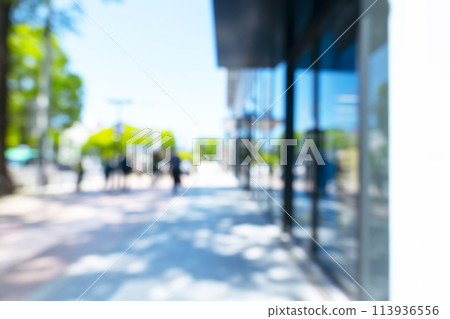 Blurred background of business district in early summer 113936556