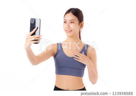 Portrait young asian woman in sportswear workout and selfie on smartphone isolated. Portrait young asian woman in sportswear workout and selfie on smartphone isolated. 113938088