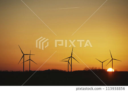 Wind turbines in the Danish countryside at sunset 113938856