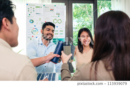 diversity team toasting celebration with reusable bottle of sustainability goals is success at green environment office diversity team toasting celebration with reusable bottle of sustainability goals is success at green environment office 113939079