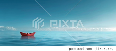 Red paper boat on a calm blue ocean 113939379