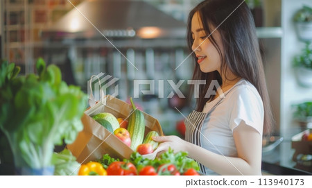 A woman with creativity in her eyes, stands confidently in front of a vibrant counter filled with an array of fresh vegetables. A woman with creativity in her eyes, stands confidently in front of a vibrant counter filled with an array of fresh vegetables. 113940173