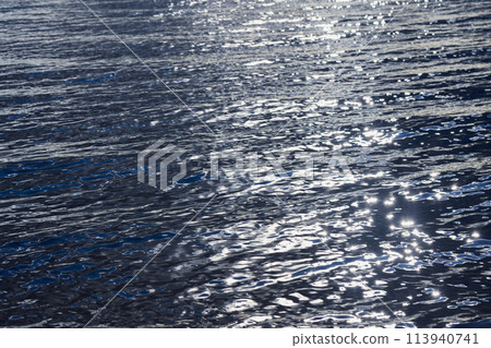 Shiny deep blue sea water with bright reflections, natural background Shiny deep blue sea water with bright reflections, natural background 113940741
