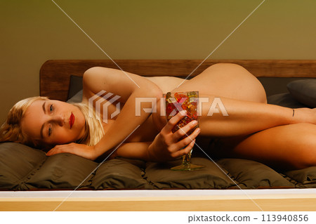 "Dreaming beauty: Blonde woman with jelly bear jar on the bed" "Dreaming beauty: Blonde woman with jelly bear jar on the bed" 113940856
