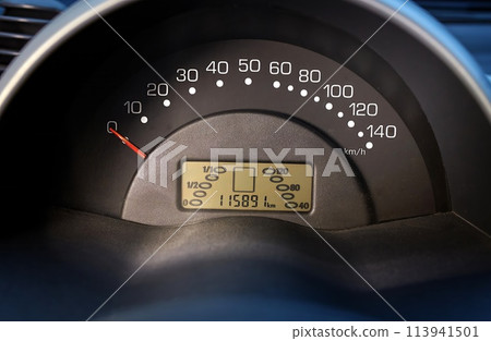 Car speedometer and sensors on a control panel background, car elements close view Car speedometer and sensors on a control panel background, car elements close view 113941501