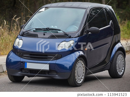 Little blue car driving on the road,  modern city car background 113941523