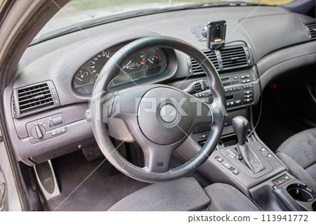 White car with a street background. Modern city car photo 113941772