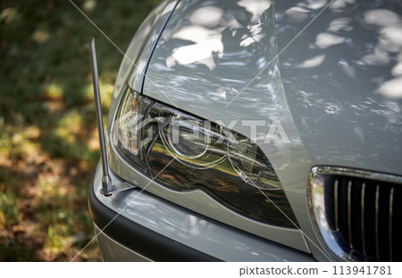 White car with a street background. Modern city car photo White car with a street background. Modern city car photo 113941781