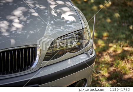 White car with a street background. Modern city car photo 113941783