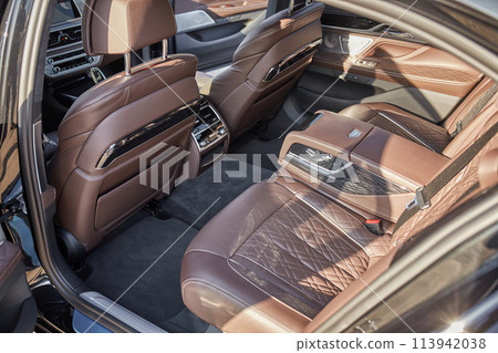 Inside moden car background, luxury car interior elements wallpaper. Black leather car interior Inside moden car background, luxury car interior elements wallpaper. Black leather car interior 113942038