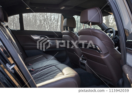 Inside moden car background, luxury car interior elements wallpaper. Black leather car interior Inside moden car background, luxury car interior elements wallpaper. Black leather car interior 113942039