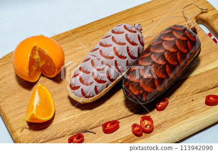 Tasty sausages and vegetables isolated over solid background Tasty sausages and vegetables isolated over solid background 113942090
