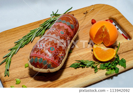 Tasty sausages and vegetables isolated over solid background Tasty sausages and vegetables isolated over solid background 113942092