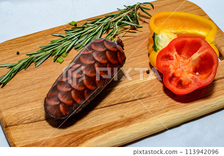 Tasty sausages and vegetables isolated over solid background 113942096