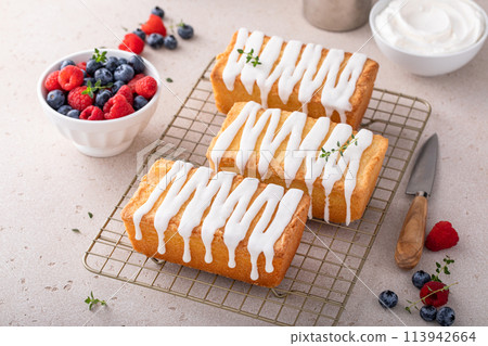 Classic pound cake with powdered sugar glaze dripping over Classic pound cake with powdered sugar glaze dripping over 113942664