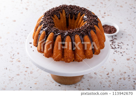Orange pound cake with dark chocolate ganache and sprinkles Orange pound cake with dark chocolate ganache and sprinkles 113942670