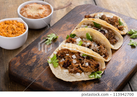 Pork carnitas tacos on a cutting board 113942700