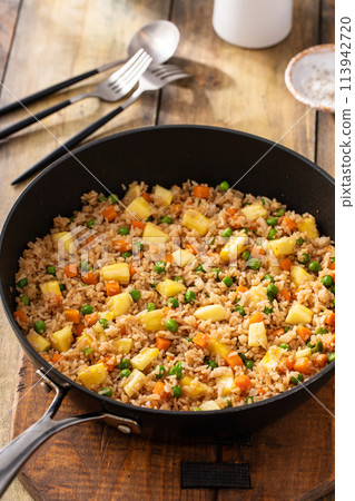 Pineapple fried rice with peas and carrots 113942720