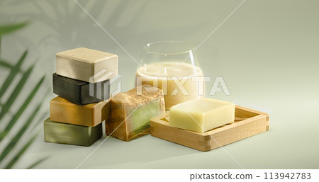 Handmade Soaps on green background. 113942783