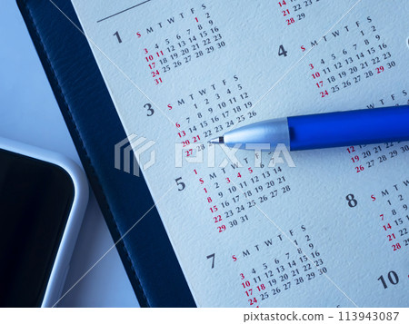 Notebook, calendar and smartphone on the table Notebook, calendar and smartphone on the table 113943087