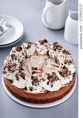 Chocolate cheesecake with whipped cream and chocolate shavings Chocolate cheesecake with whipped cream and chocolate shavings 113943117