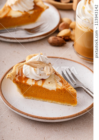 Pumpkin pie with cheesecake swirl, dessert variation for Thanksgiving 113943142