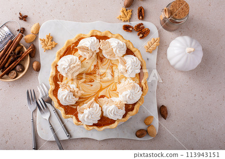 Pumpkin pie with cheesecake swirl, dessert variation for Thanksgiving Pumpkin pie with cheesecake swirl, dessert variation for Thanksgiving 113943151