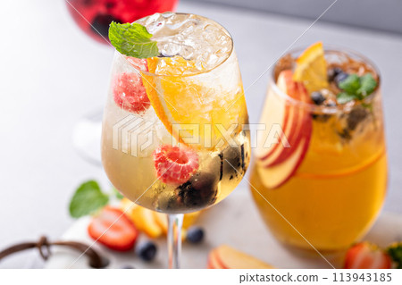 Refreshing summer berry sangrias with white and red wine Refreshing summer berry sangrias with white and red wine 113943185