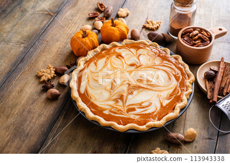 Pumpkin pie with cheesecake swirl for Thanksgiving 113943338