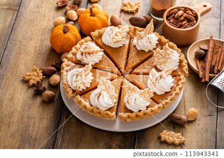 Traditional pumpkin pie for Thanksgiving with whipped cream Traditional pumpkin pie for Thanksgiving with whipped cream 113943341