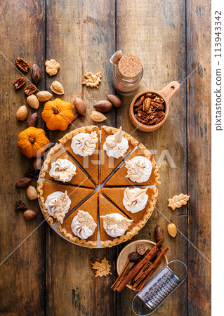 Traditional pumpkin pie for Thanksgiving with whipped cream Traditional pumpkin pie for Thanksgiving with whipped cream 113943342