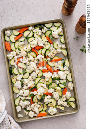 Various vegetables ready to be roasted, sheet pan side dish recipe 113943413